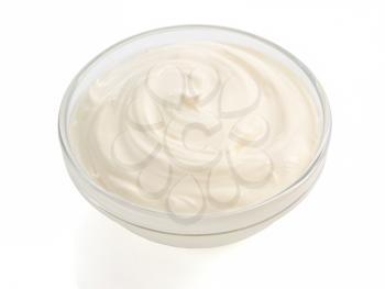 sour cream in bowl on white background