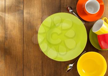 ceramic dishes set on wooden background