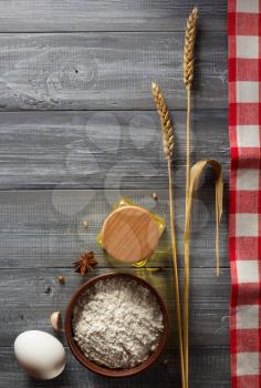 ears of oat on wooden background