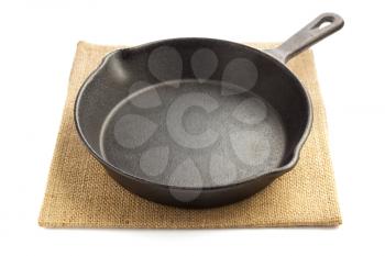 frying pan and napkin isolated on white background