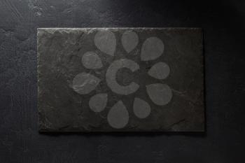 stone and slate on black background