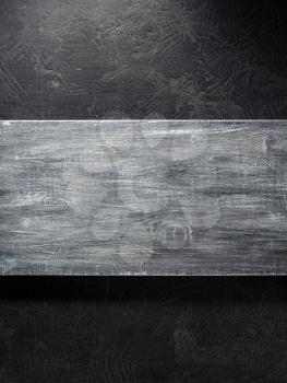 wooden signboard at black background texture