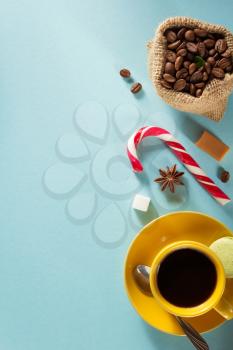 coffee cup and beans at colorful background