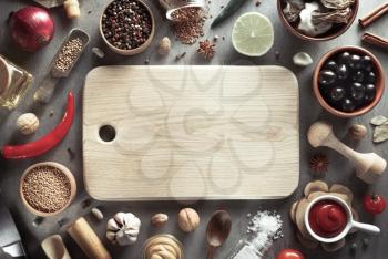 herbs and spices and wooden cutting board