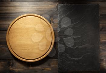 pizza cutting board at brown background texture