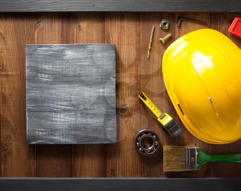 construction tools on wooden background