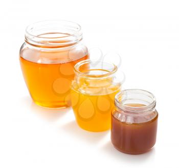 variety of honey in jar isolated on white background