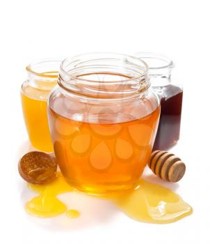 variety of honey in jar isolated on white background