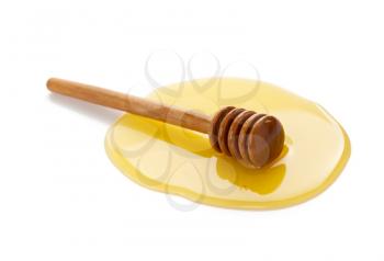 honey and wooden dipper isolated on white background