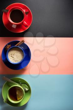 cup of coffee and tea at abstract colorful background