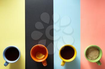 cup of coffee and tea at abstract background