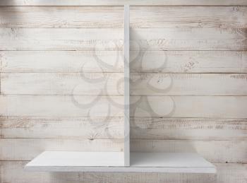 wooden shelf at white wall background texture