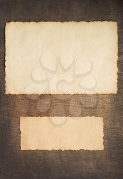 old retro aged paper parchment  at wooden background