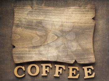 coffee letters and signboard at old wooden background, top view