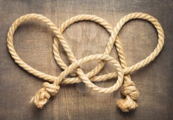 ship rope at wooden background surface, top view