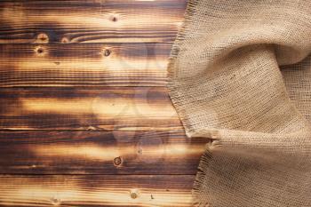 burlap hessian sacking texture on wooden background surface