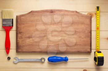tools at plank wooden board table background texture