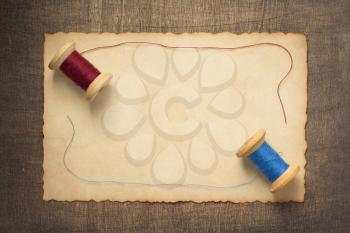 sewing thread on wooden table background