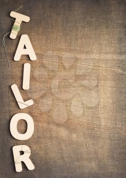 tailor letters on wooden table background