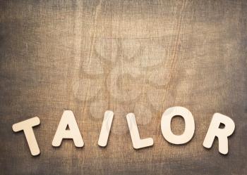 tailor letters on wooden table background