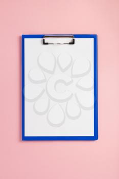 paper clipboard at abstract background surface
