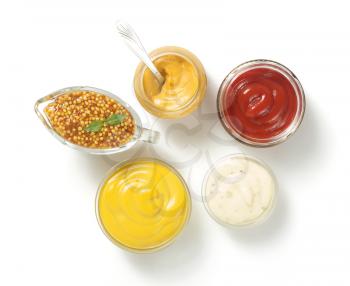 tomato sauce, mayonnaise and mustard in bowl isolated on white background