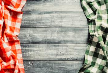 cloth checked napkin on wooden background