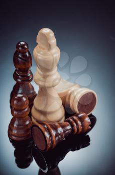 chess figures on black glossy background