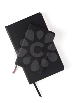 closed notebook or notepad at white background, top view