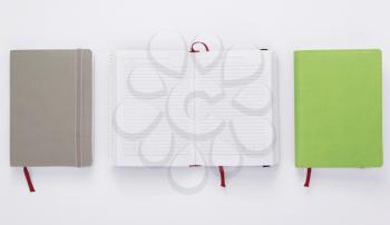 paper notebook at white background, top view