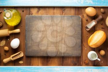 bread and bakery ingredients on wooden table background, top view