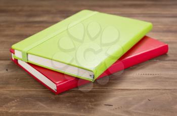 notebook or book at wooden table background,