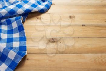 cloth napkin at rustic table in front,wooden plank board background