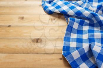 cloth napkin at rustic table in front,wooden plank board background