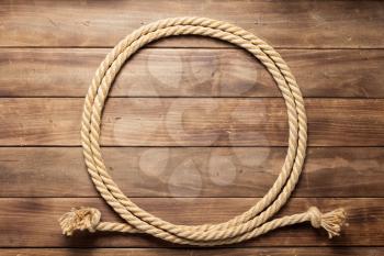 ship rope at wooden background texture, top veiw