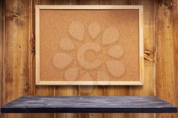 cork board on wooden wall background texture