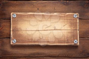 aged wooden signboard or nameplate on board bar background
