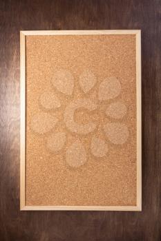 cork board on wooden background texture