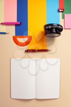 school accessories and office supplies at abstract paper background surface