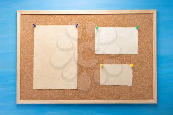 cork board and memory paper on wooden background texture
