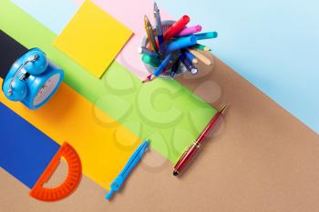 school accessories and office supplies at abstract paper background surface