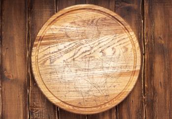 pizza cutting board or tray at wooden background texture