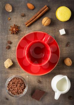 coffee concept, cup and spices on wooden background, top view