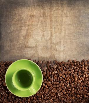 coffee concept, cup and beans on wooden background, top view