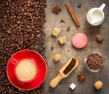coffee concept, cup and beans on wooden background, top view