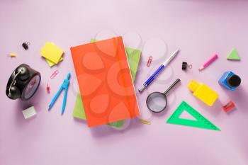 office and school supplies at abstract paper background
