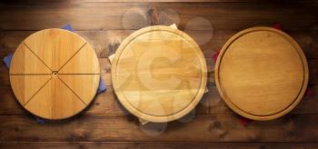 pizza cutting board and napkin cloth at wooden table, top view