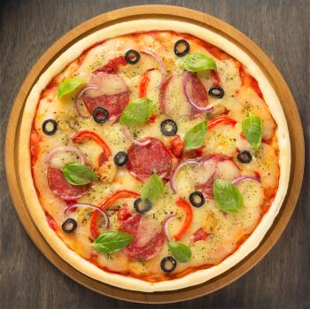pizza at wooden table, top view