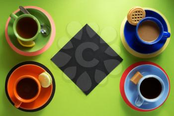 cup of coffee and tea at abstract green background