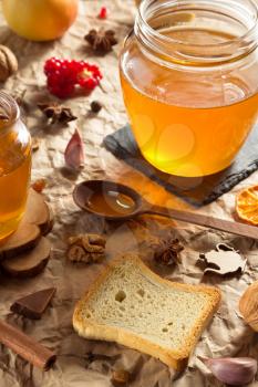 glass jar of honey on paper background